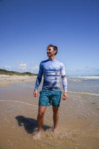 Model wearing rashie printed with a photo of Scarborough beach, Perth - front
